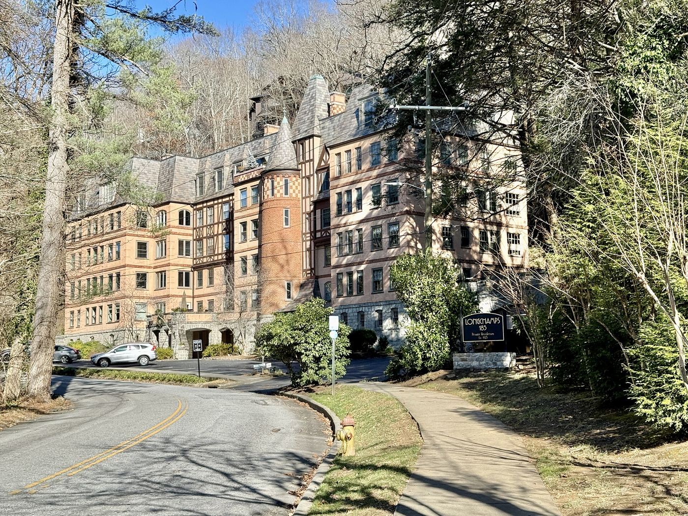 Country Club Road, a wide tree-lined residential street in Grove Park