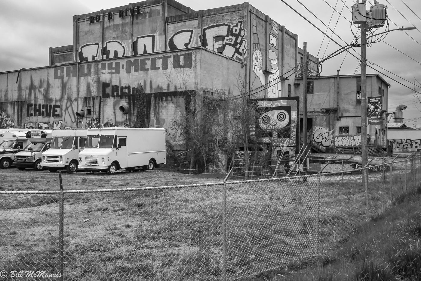 Murals and graffiti art on old mill buildings in Asheville's River Arts District